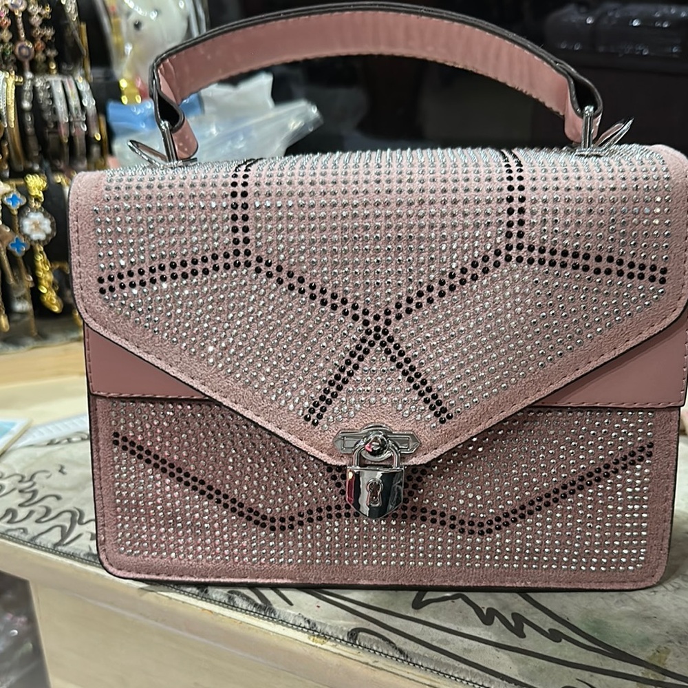 Pink Geometric Perforated Satchel with Angular Flap